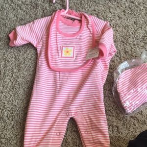 Pink and white striped onesie and flower bib